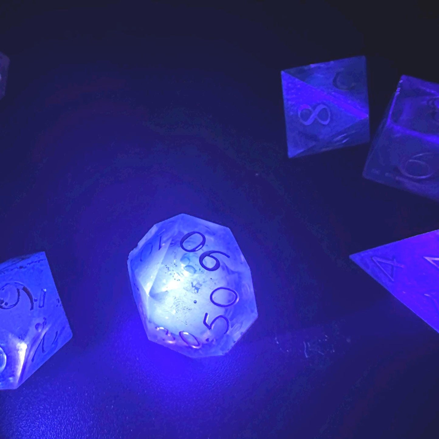Blue UV Reactive Liquid Core Dice Set: Sharp Edge Polyhedral DnD Dice